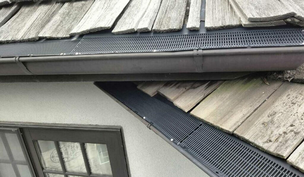 gutters with protective screens on the roof