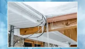 Close-up of ice dam formation on a roof with heated cables installed for preventing ice dams.