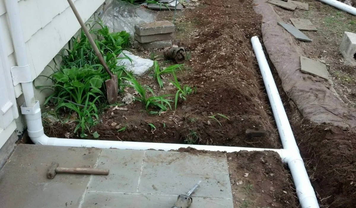 Underground Draining Services Naperville IL Partially installed underground gutter drains showing trench and piping layout for efficient water redirection and drainage.